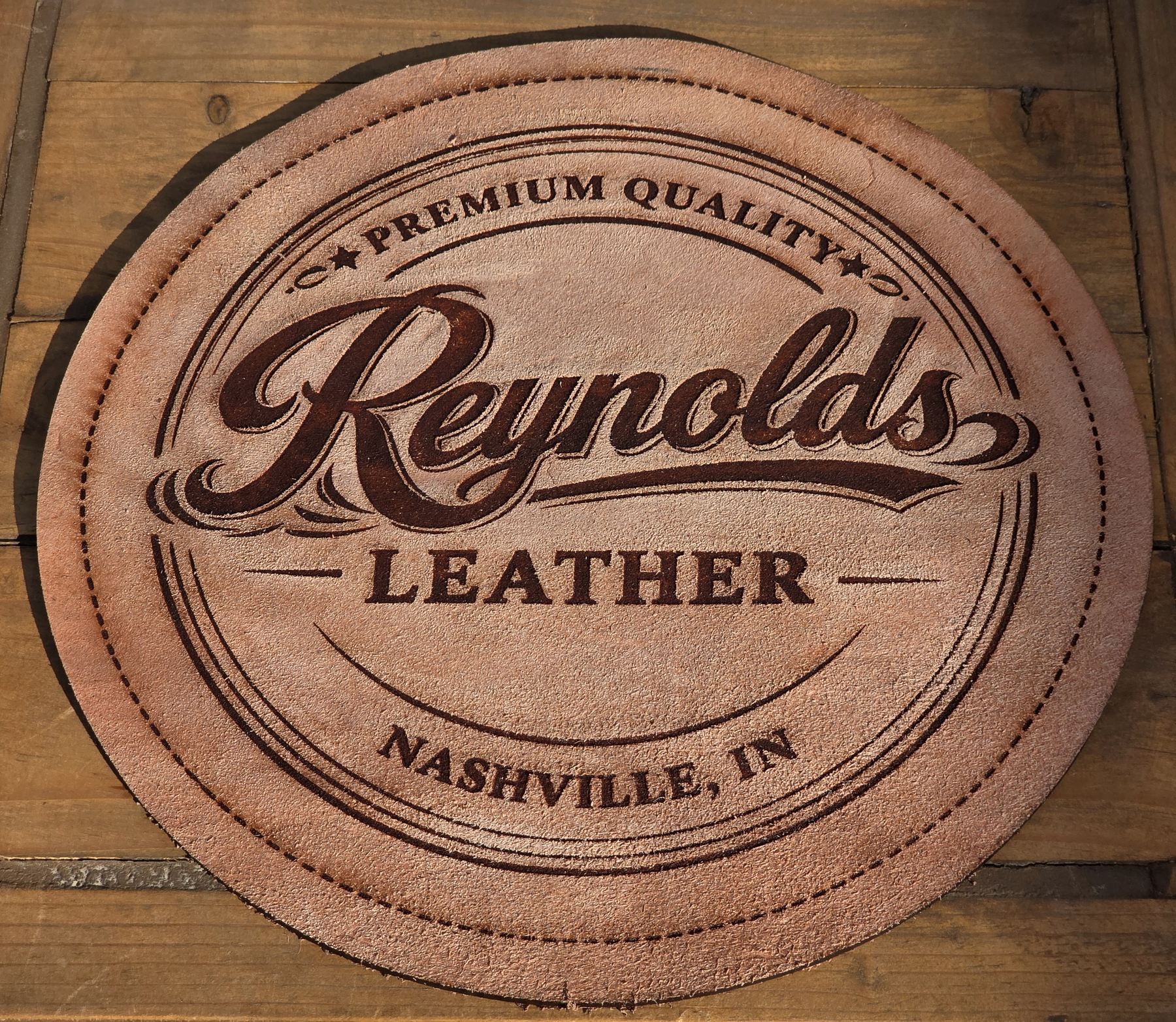Reynolds Leather logo embossed on a round leather patch, Nashville, IN
